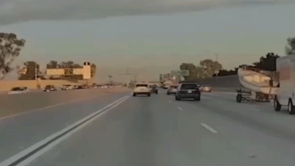 Boat trailer crashes over center median on busy California freeway, driver doesn’t stop