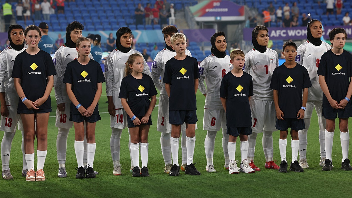Iranian women's soccer team refuse to sing national anthem in silent protest at Asian Cup  at george magazine