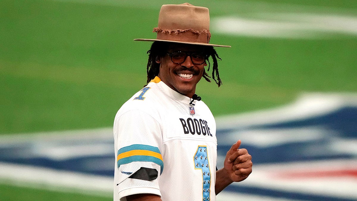 Ex-NFL star Cam Newton gets candid about marriage expectations, giving woman a ring  at george magazine