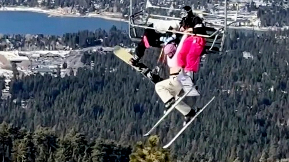 Skier's prank backfires, leaving her dangling 65 feet in the air as twin desperately holds on  at george magazine